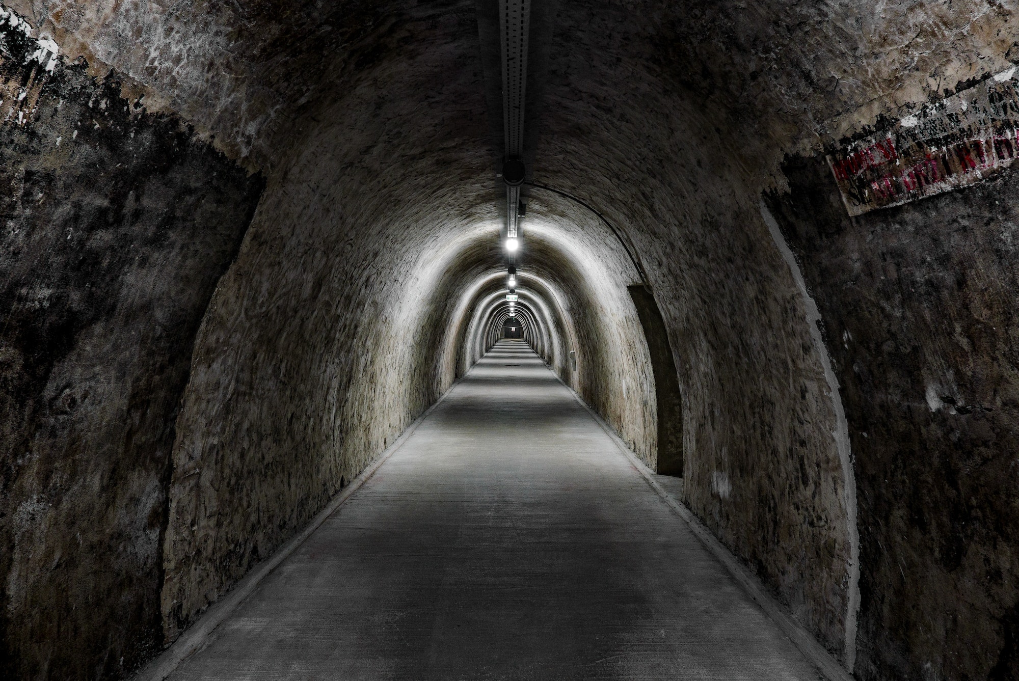 Diminishing perspective in a long underground tunnel.